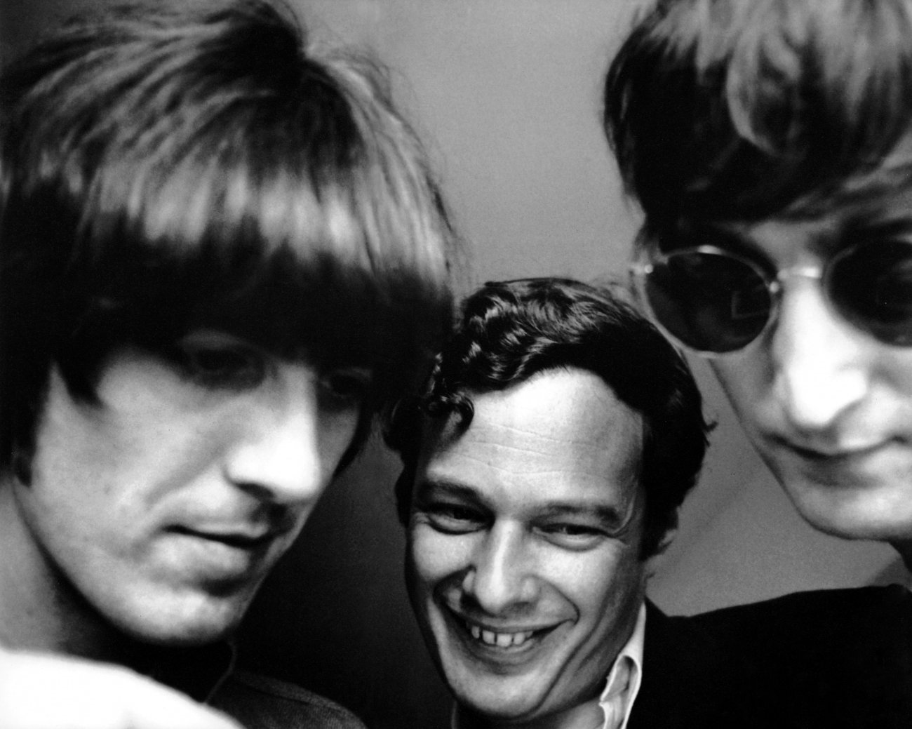 Brian Epstein with George and John